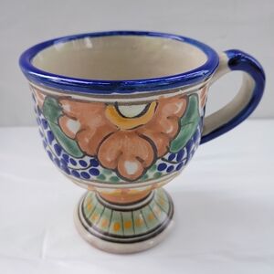 Handcrafted Ceramic Mug with Blue and Orange Floral Design